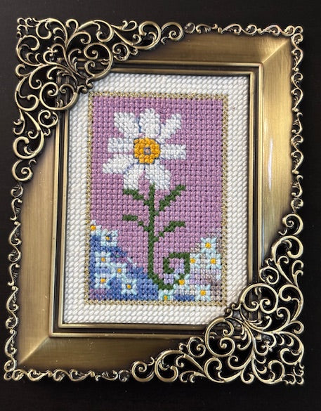 naive cross stitch daisy. Birth Flower of the month April.