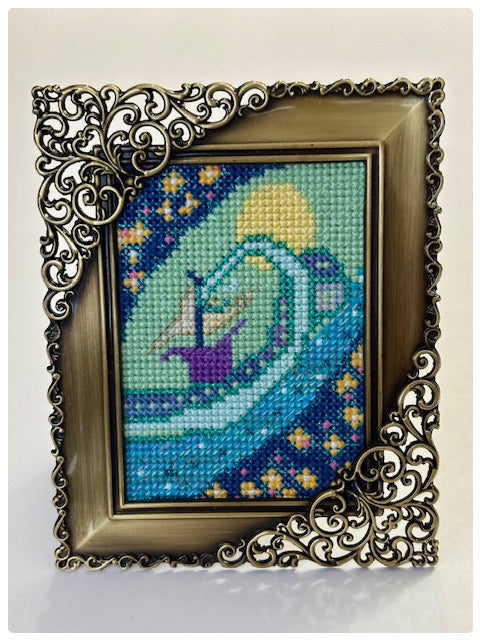 Cross stitch folk art boat on a wave 2.5 x 3.5 inches. original art framed.