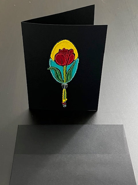 Handmade beaded rose art card by artist Kathy Poitras, shown standing beside its black envelope. Features acrylic painting, bead embroidery, and mixed‑media folk art design.