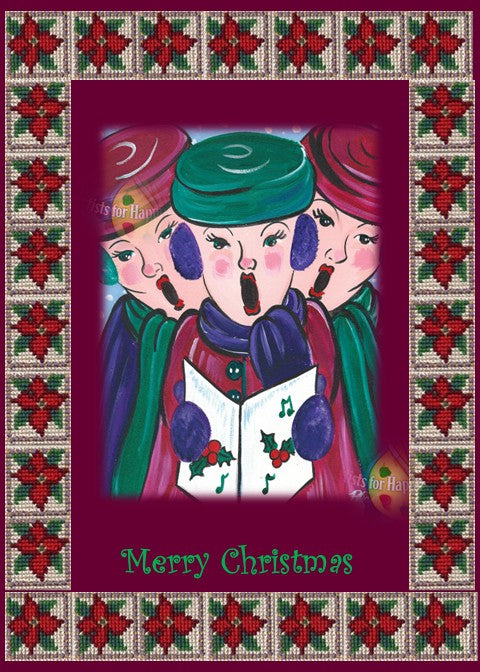 Photographic print of a Christmas card featuring three cheerful carolers dressed in winter hats and scarves, singing from a holly-decorated songbook. The background is deep burgundy with falling snowflakes, framed by a cross-stitch-style border of red poinsettias and green leaves on beige. “Merry Christmas” is written in decorative green lettering at the bottom.