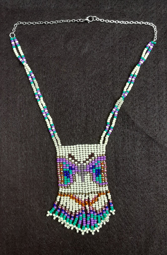 Beaded medallion. Butterfly with fringe